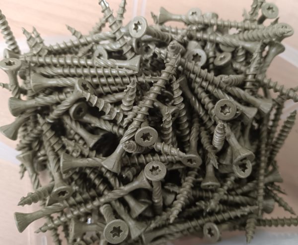 A close-up image of decking screws in a transparent container.