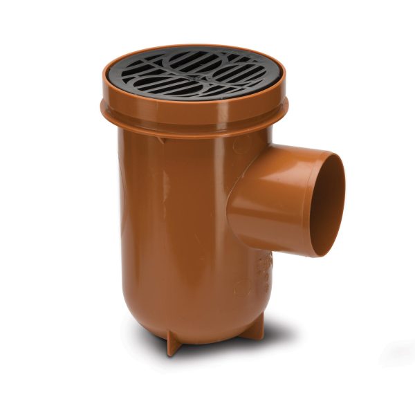 A brown and black plastic gully drain in front of a white background.