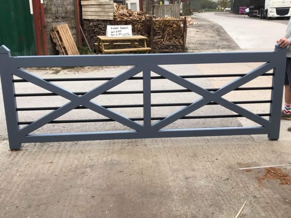 A grey made to measure wooden gate in a timber yard