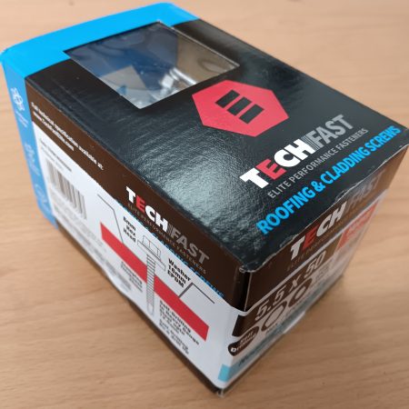 A black, red and blue box containing roofing and cladding screws by Tech Fast.